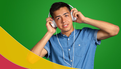 Young man listening to music in his white headphones