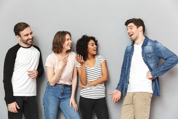 Fototapeta premium Emotional excited group of friends talking with each other.