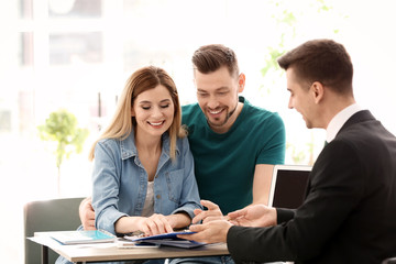 Young couple meeting with consultant in office - Powered by Adobe