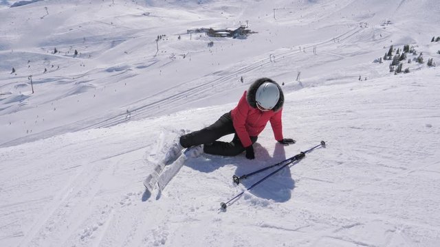 Skier Woman Fell On The Ski Slope And Trying To Stand On The Feet