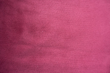 Cerise red artificial suede fabric from above