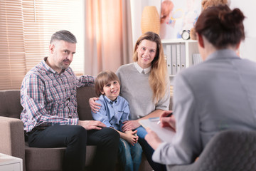 Smiling son with happy parents