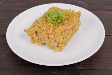 Polenta with poppy and vegetables on a table