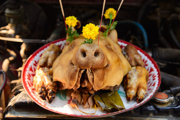 Close up boiled pig's head , Thai food for pay respect to god,Offerings to gods in Thailand