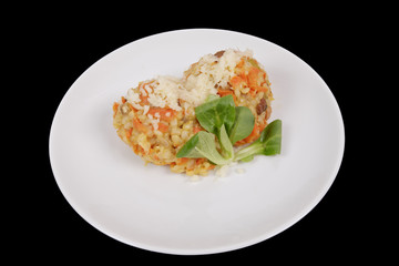 Risotto with carrot and cheese on black