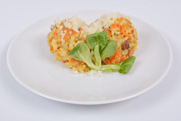 Risotto with carrot and cheese on white