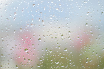 Raindrops on glass close up.
