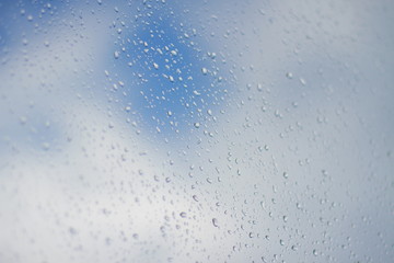 Raindrops on glass close up.
