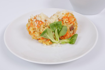Risotto with carrot and cheese on white