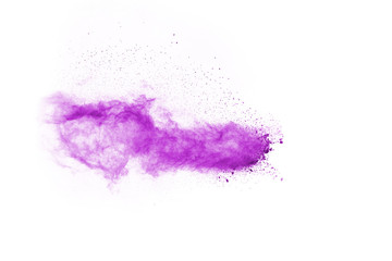 Fototapeta na wymiar Powder explosion. Closeup of a purple dust particle explosion isolated on white. Abstract background.