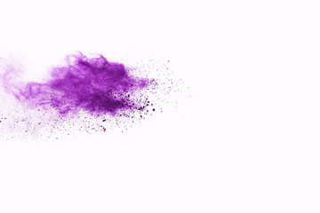 Purple powder explosion on white background. Colored cloud. Colorful dust explode. Paint Holi.