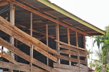 Wooden house construction with zinc roof. Industry concept.