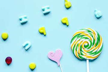 sweets and sugar candies on blue background top view pattern