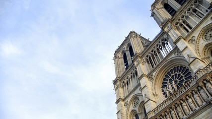 Fototapeta na wymiar Amazing French Gothic architecture of Notre-Dame de Paris against cloudy sky