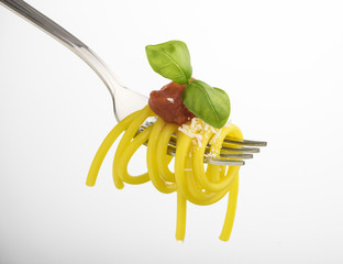 fork with spaghetti and tomato sauce isolated on white background
