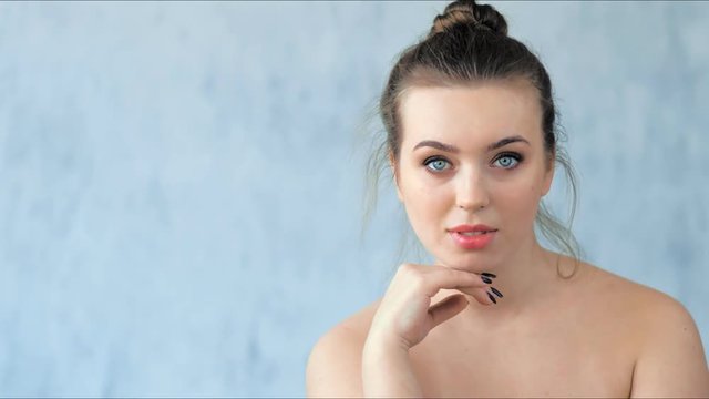 Fashion young woman with beautiful skin posing in studio