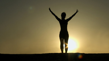 Fototapeta na wymiar Female silhouette greeting sun, successful goal achievement, strength of spirit
