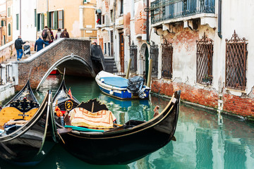 Fototapeta na wymiar VENICE, ITALY- December 21, 2017 : Tourists on water street with Gondola in Venice,ITALY