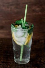 Glass of lemonade on a wooden background