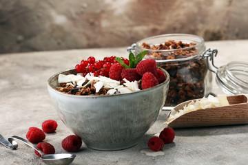 granola healthy breakfast with natural yogurt, muesli and berries