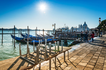 Obraz premium VENICE, ITALY- December 21, 2017 : Tourists on water street with Gondola in Venice,ITALY