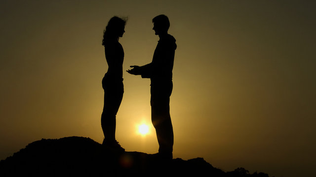 Male silhouette reaching out hands to girl, offering help, supportive friend