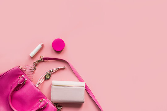 Top view of Women bag and lady stuff with copyspace on pink background,  vigtage effect photo Stock Photo | Adobe Stock