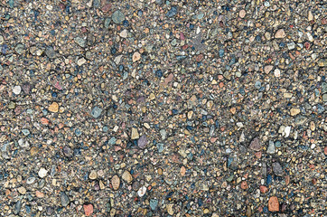 Gray textured background of asphalt with rocks