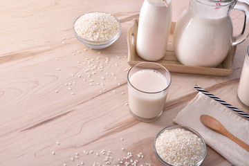 Rice drink in containers on a wood table horizontal