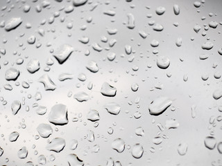 rain droplets on the glass and white background