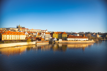 Prague castle over river Vltava at sunrise light in early morning