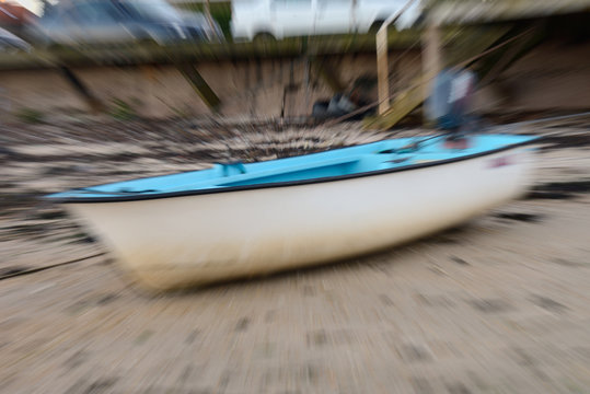 defocused image of a fishing boat on the beach