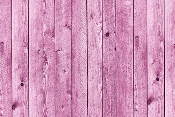 Pink flat wooden background of vertical boards
