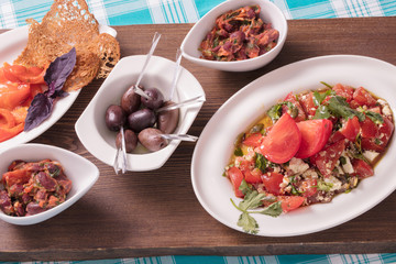 Набор закусок из овощей, красной рыбы и оливок, Set of snack from vegetables, red fish and olives