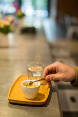 Hand stirring espresso Vertical