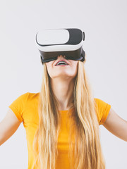 Girl wearing virtual reality goggles.