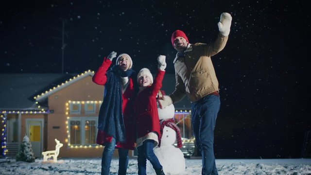 Template: Happy Young Father, Mother and Cute Little Daughter Looking around in Wonder, Gesturing, Pointing at Sky, Watching Potential Fireworks. 