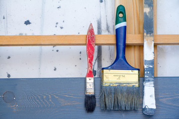 Art background. Brushes for painting on wooden canvas