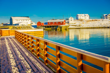 Fototapeta na wymiar Outdoor view of wooden fence located in the harbour in Lofoten islands