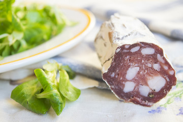 salami smoked sausage near lettuce salade