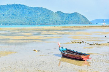 Isolated Wooden Boat on Rawai Beach in the Island of Phuket