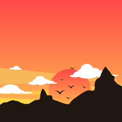 Mountains silhouette with sunset and evening clouds