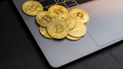 Bitcoin coins on a laptop  keyboard