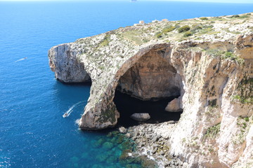 Tourist boats around the Blue Grotto at the Mediterranean Sea, Malta 