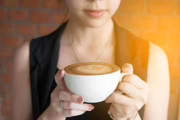 Beautiful asian gril drinking coffee in cafe restaurant, sensual girl with the coffee.
