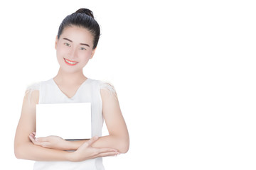 Fototapeta premium Woman holds the product for presentation. Lady beautiful in white shirt girl advertising your product on blank white sign board. Asian female model isolated on white background.