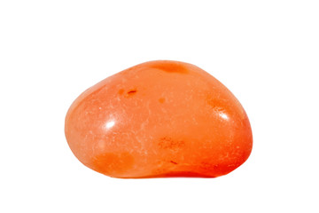 Macro shooting of natural gemstone. Mineral carnelian, India. Isolated object on a white background.