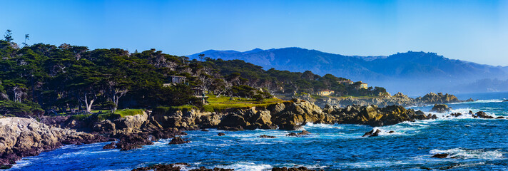 Sunset Point - Pebble Beach, California, February 17, 2018: Beautiful sea and rocky point vista along the 17 Mile Drive south of Cypress Point Golf Course overlooking Sunset Point. - obrazy, fototapety, plakaty