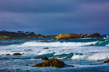Surf Rocks -Pebble Beach, California, February 18, 2018:  Wave action on the rocks at Pebble Beach highlighting Bird Rock, Seal Rock, Cypress Point Golf Course, Fan Shell Beach located on 17 Mile Dr. © bullsiphoto