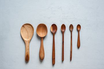 Many wooden spoons are handmade in different sizes.